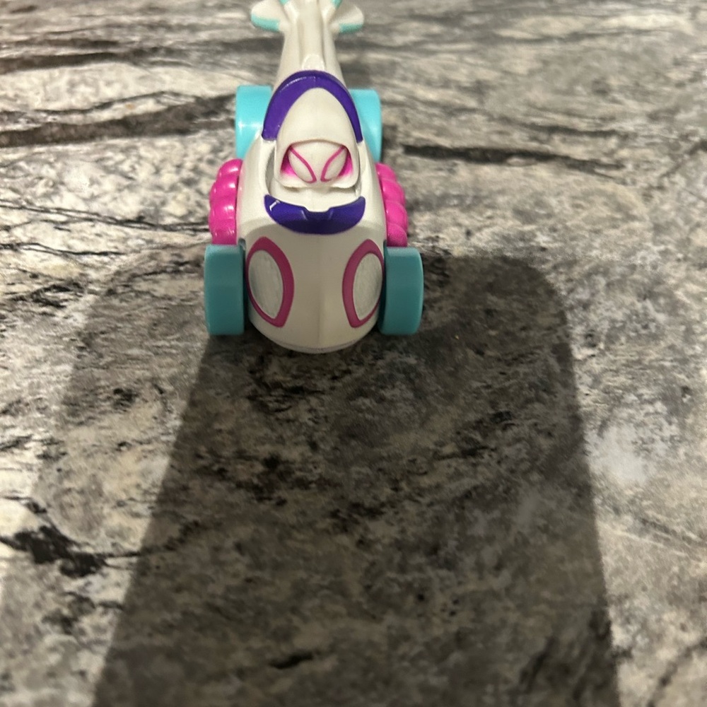 White and Pink Toy Vehicle with Minimalist Design